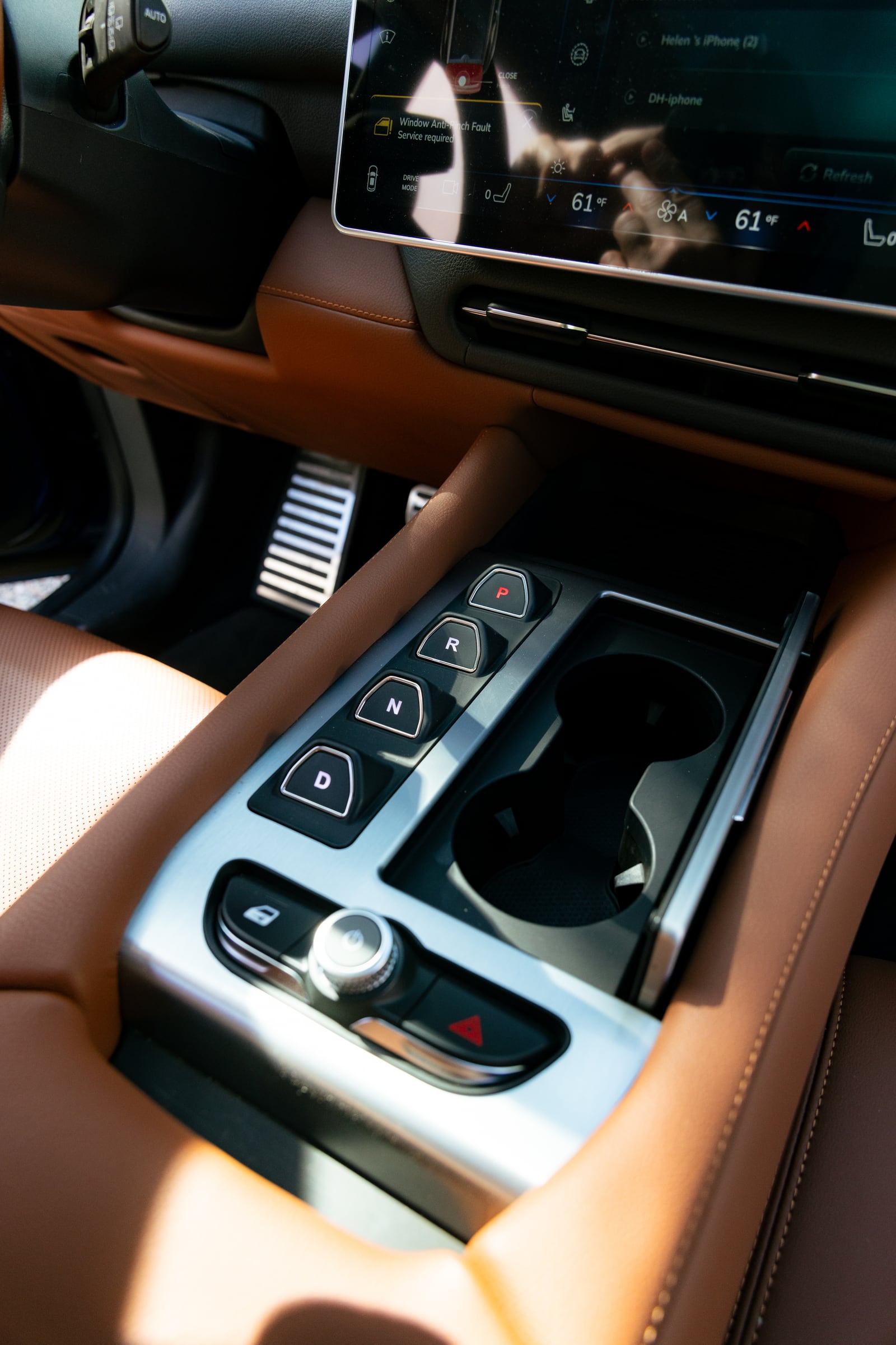 VinFast VF 9 centre console with drive selector, cupholders and the climate controls on the central screen
